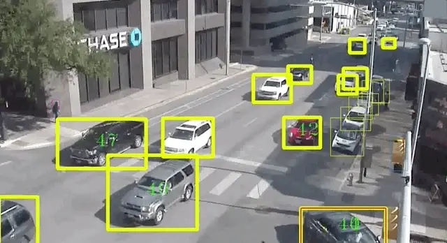 An AI overlay actively tracking moving cars in real time